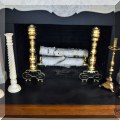 D07. Impressive brass andirons and candle holders. 